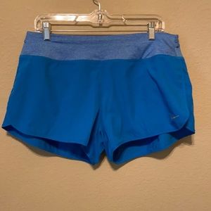 Nike women’s DRI-FIT running shorts. Size L